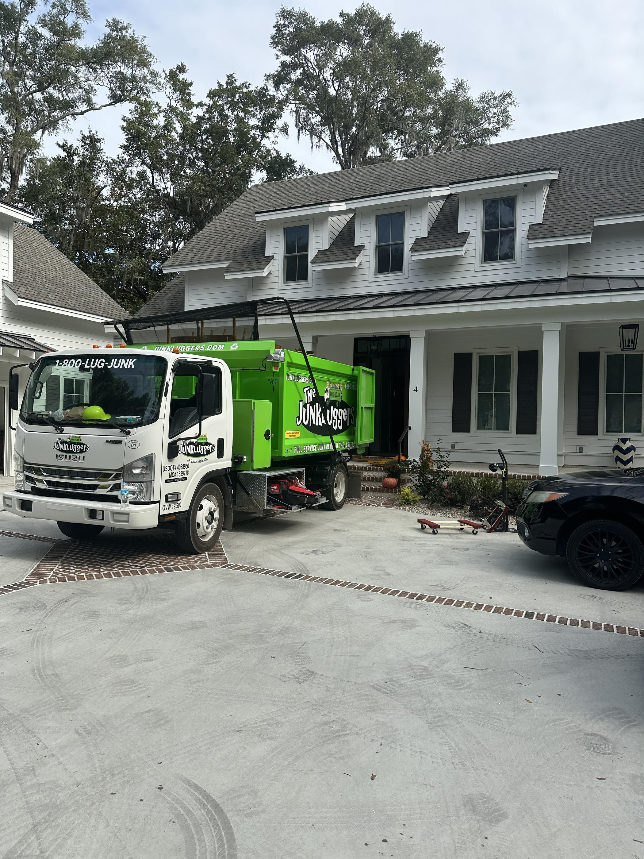 Junkluggers employees in front of their truck