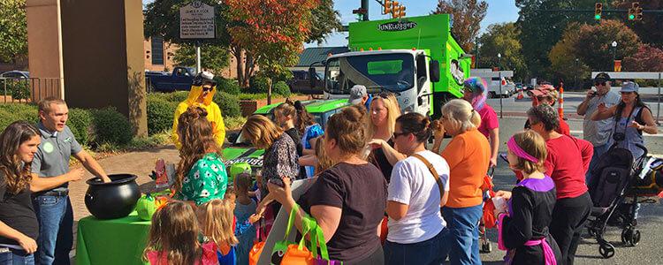 The Junkluggers Team Handing Out Candy During The Candy Crawl 