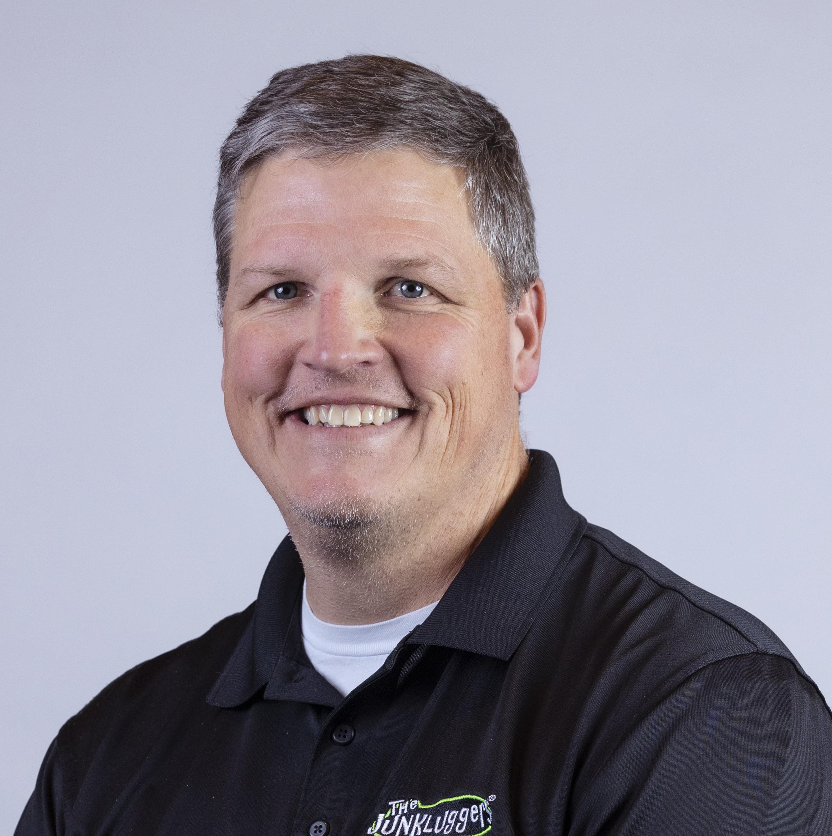 The Junkluggers' junk-hauling truck in a field