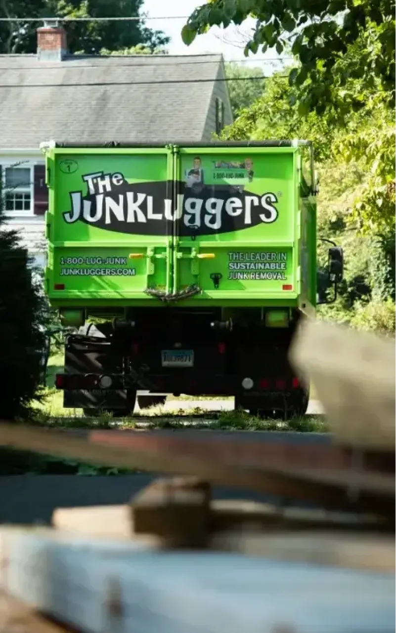 Junkluggers truck parked in a driveway