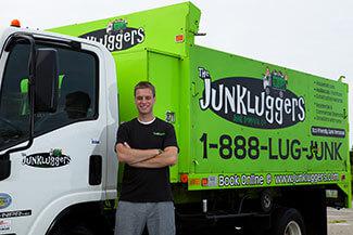 Josh Cohen Standing In Front Of A Junkluggers Truck