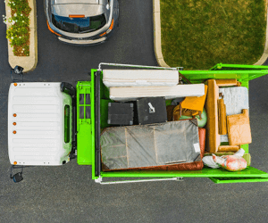 Junk removal truck filled with furniture.