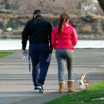 Couple Walking Their Dog