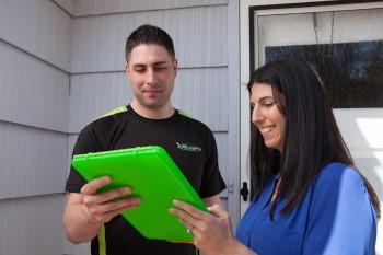 Local junk removal contractor meeting with a homeowner.