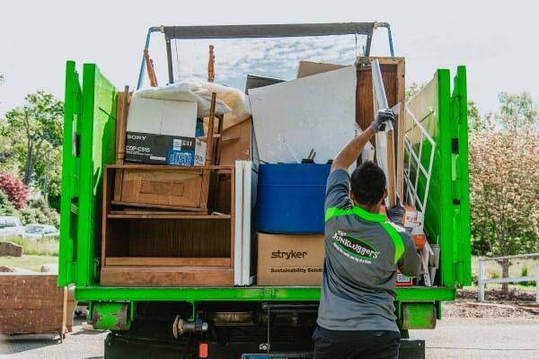 Local Junkluggers help declutter a garage.