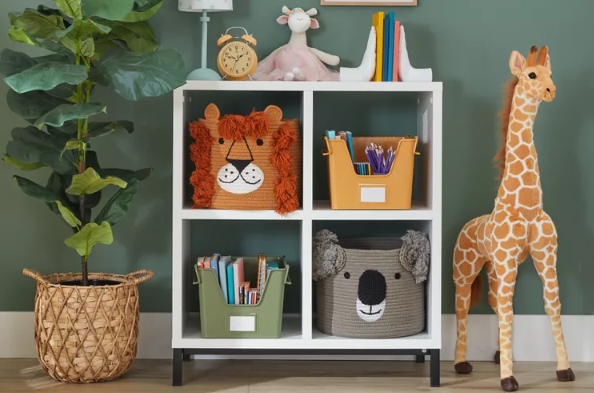 organized kids toy area with green walls